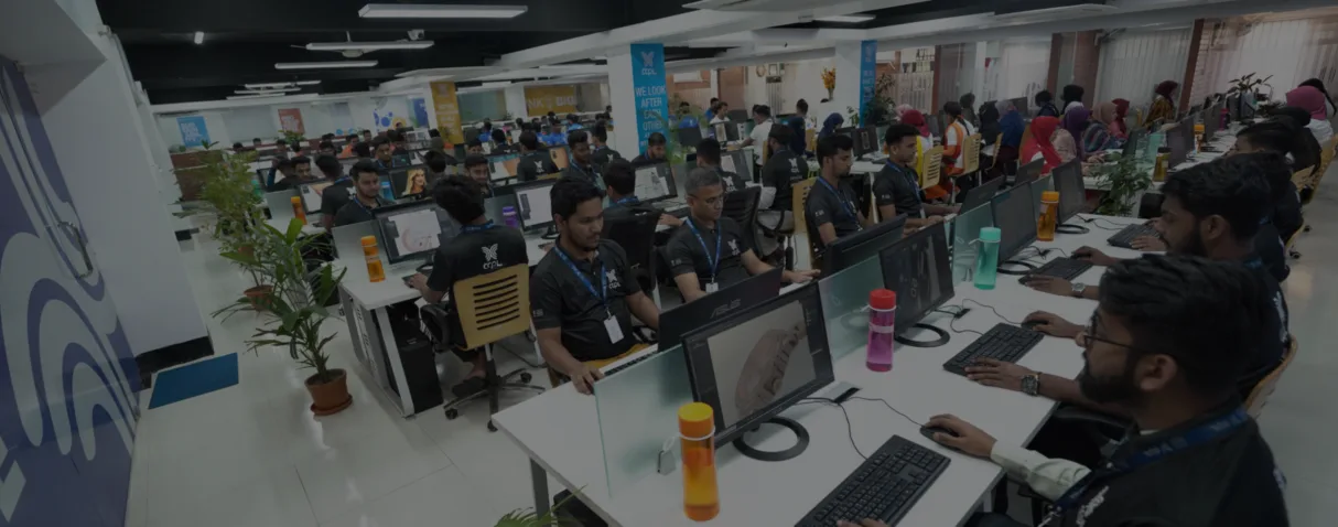 Rows of people working at computers across the Desvert studio floor.